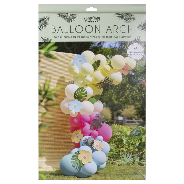 Arco di palloncini colorati con foglie e fiori